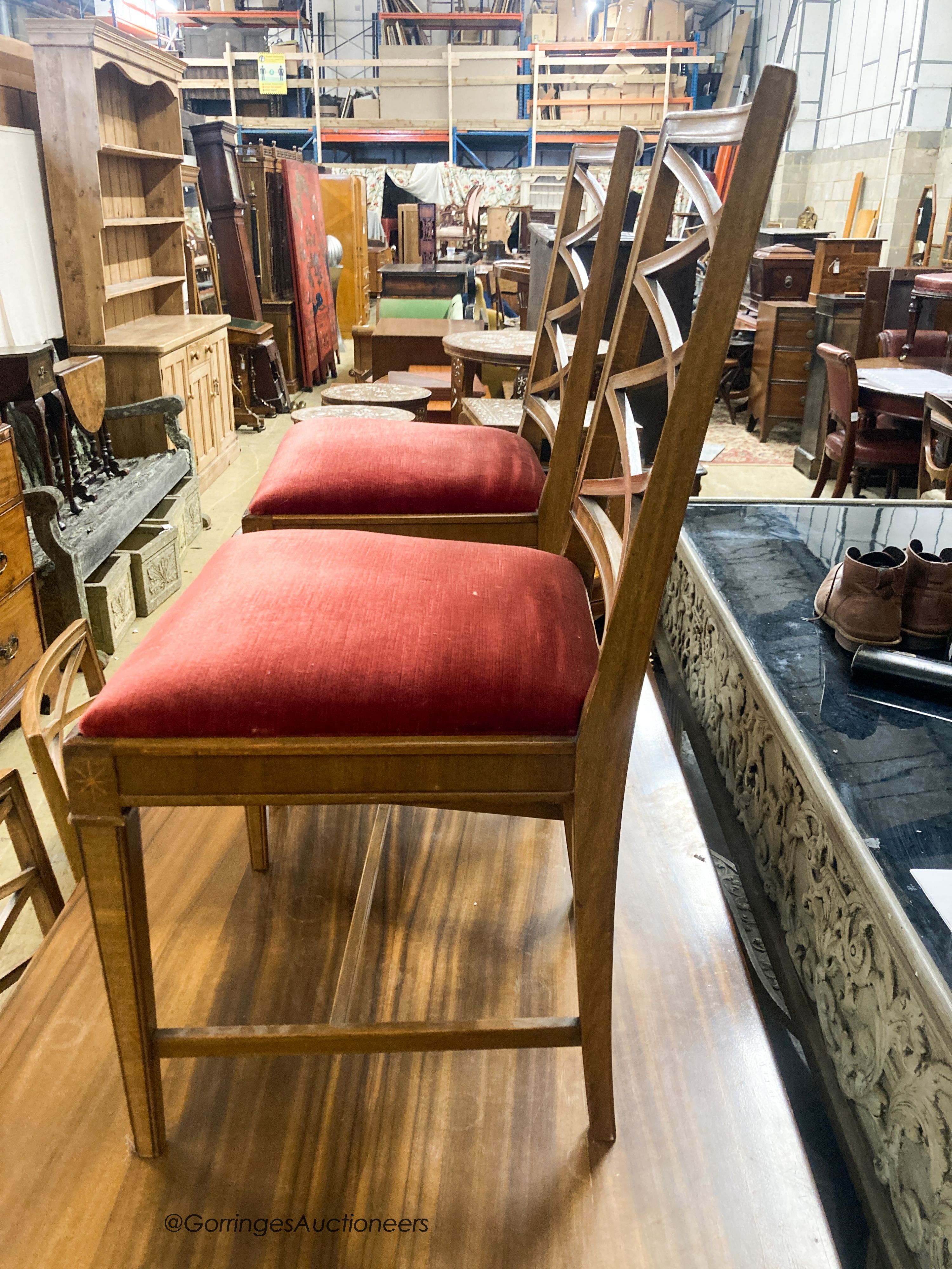 A Swedish walnut and beech dining suite comprising rectangular table. 200cm extended (two spare leaves) and four lattice back chairs with upholstered drop in seats